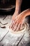 Cooking bakery hands crumple dough into  flat cake