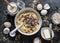 Cooking banana oatmeal cake with white and milk chocolate. Ingredients for the cake on a dark background, top view. Flat lay