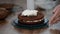 Cooking cake. Chocolate sponge cake with cream. Pastry bag