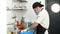 Cooking. the chef, in protective mask and gloves, is cutting boiled potatoes on cooking board. health food and safety