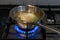 Cooking chicken broth on gas stove