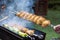 Cooking chicken and vegetables on a picnic grill