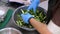 Cooking. close-up. the chef, in protective gloves, prepares a salad in a large bowl. health food. safety concept