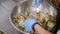 Cooking. close-up. the chef, in protective gloves, prepares a salad in a large bowl. health food. safety concept