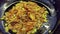 Cooking. close-up, onions with carrots are fried in a pan. vegetable oil boils and bubbles, steam goes. health food and