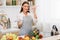 Cooking concept. Woman tasting soup from spoon