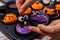 Cooking delicious homemade cake and decorate cupcake for Halloween festive. Preparing and mixing ingredients for sweet food