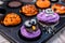 Cooking delicious homemade cake and decorate cupcake for Halloween festive. Preparing and mixing ingredients for sweet food