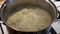 Cooking Delicious Millet Yellow Porridge in a Saucepan on the Stove.