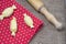 Cooking domestic food. Preparation raw Italian ravioli. Homemade  diy. Topview. Sackcloth natural red background