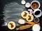 Cooking Easter biscuits with ingredients on black background