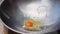 Cooking eggs in a wok. Step by step cooking pad thai. Thai cuisine. Closeup. 4k