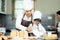 Cooking Family. Chef parent and kid boy cooking toast and make  bread for dinner.