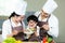 Cooking Family. Chef parent and kid boy make fresh vegetables salad for healthy eat.