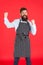 Cooking for family. Modern cafe concept. Cooking modern meals. Man with beard cook hipster apron. Hipster chef cook red