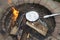 Cooking a foil covered pan of popcorn on fire pit