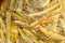 Cooking french fries in oil close-up, background. Potato frying with bubble