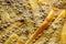 Cooking french fries in oil close-up, background. Potato frying with bubble