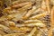 Cooking french fries in oil close-up, background. Potato frying with bubble