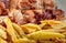 Cooking french fries in oil close-up, background. Potato frying with bubble