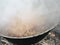 Cooking goulash in cauldron, outside, in a campsite