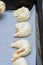 Cooking homemade bagels. Kneading dough, cutting and molding dough. Croissants