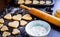 Cooking homemade cookies with hands on dark background