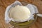 Cooking homemade cottage cheese, cheese curd product. Draining of curdled milk, whey separation