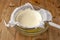 Cooking homemade cottage cheese, cheese curd product. Draining of curdled milk, whey separation