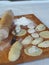 Cooking homemade dumplings.In the kitchen there is a cutting Board, dough, dumplings with potato filling.Kitchen utensils