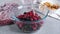 Cooking homemade healthy drink or compote from dried apples and frozen berries