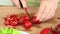 Cooking homemade vegetable salad with cherry tomatoes, cheese and quail eggs