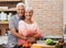 Cooking, hug and portrait of old couple in kitchen for salad, love and nutrition. Happy, smile and retirement with