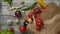 Cooking ingredients falling on paper bag and table