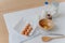 Cooking ingredients on kitchen table. View from above of eggs, milk and flour, whisk and wooden spatula near. Utensils and fresh