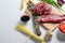 Cooking ingredients for making stir-fried yakisoba with beef. Side view on white table with space for text