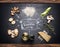 Cooking Ingredients for mushrooms risotto with hand drawings on dark chalkboard