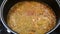 Cooking lentils into the pot.