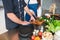 Cooking lessons from the chef for the girl. Close-up of the hand of a girl and a man.