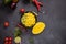 Cooking mango salsa - sliced chopped ingredients in a black ceramic bowl