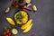 Cooking mango salsa - sliced chopped ingredients in a black ceramic bowl