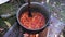 Cooking mashed vegetables in the yard at wood fire