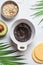 Cooking mask of black clay, avocado and oatmeal, white background. Skincare concept