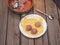 Cooking meatballs from turkey minced meat, in the background raw minced meat. The composition is on a rustic boardwalk table