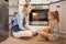 Cooking, mom and child on kitchen floor in house talk and relax while waiting for food in the oven. Canada mother