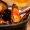 Cooking mussel opens in tomato sauce, spicy seafood, rich source of easily digestible protein