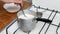 Cooking oatmeal, boiling milk and oatmeal in a plate, close-up, stir with a spoon, cereal