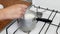 Cooking oatmeal, boiling milk and oatmeal in a plate, close-up, stir with a spoon, cereal