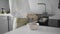 Cooking oatmeal, a woman pours cooked porridge in plates, close-up, breakfast