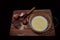 Cooking an omelet. In a bowl, milk, chicken eggs, whisk. Near the plate are eggshells